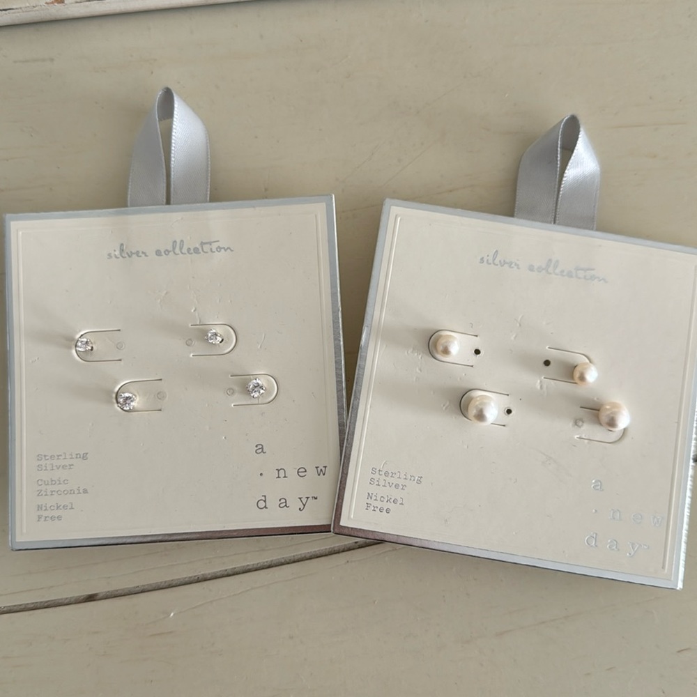 A new day silver collection earrings- 4 pairs never used